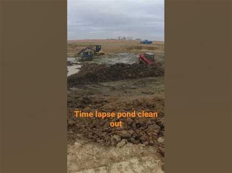 Time lapse & Bobcat skid steer dirt work, washed out pond dam 